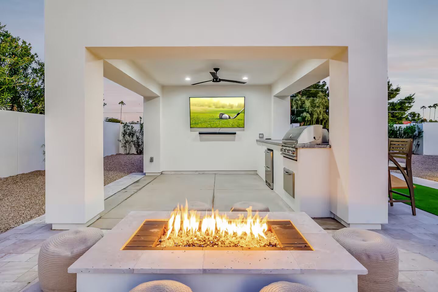 The firepit and patio lounge at Querencia at twilight